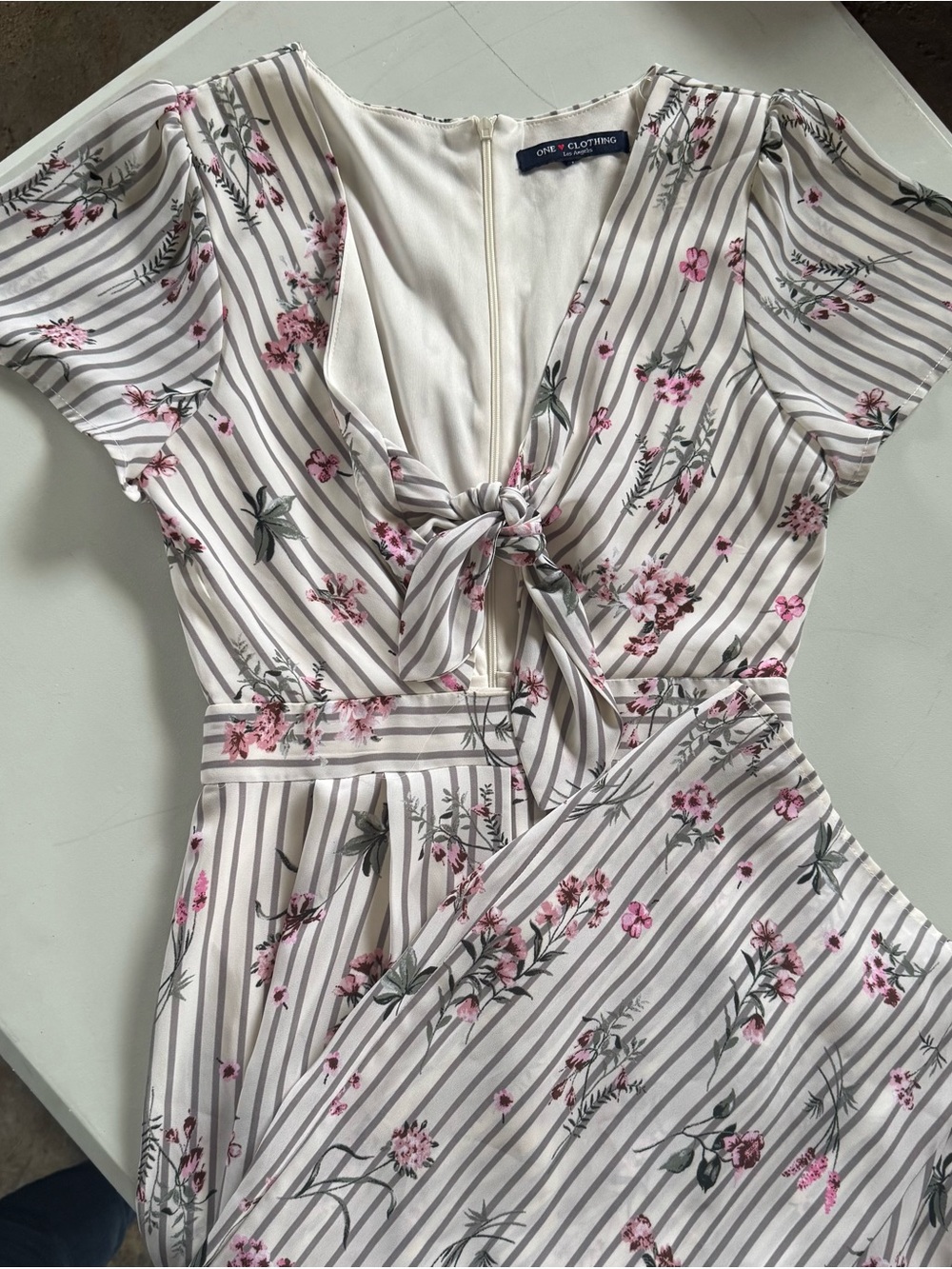 One Clothing Cream Romper with Gray Stripes and Pink Floral Accents